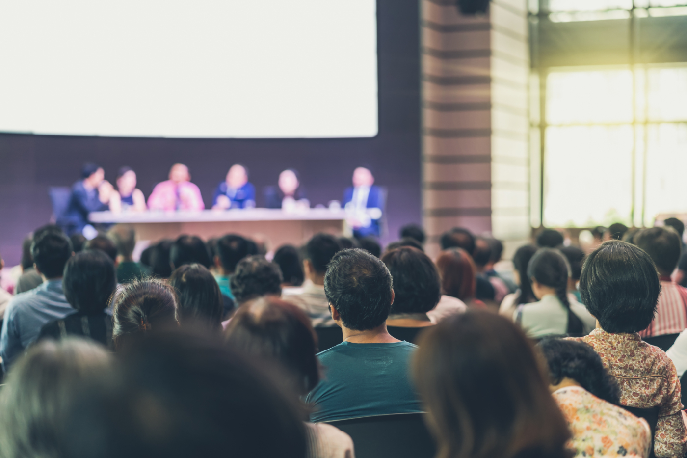 Rear view of Audience in the conference hall or seminar meeting